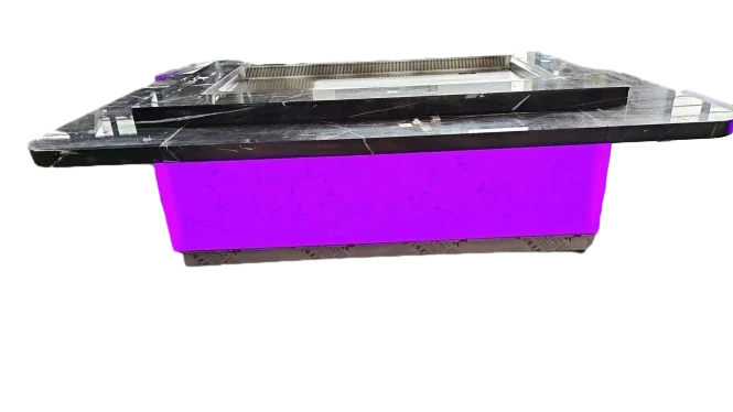 Teppanyaki station with black marble counter and purple LED illuminated base