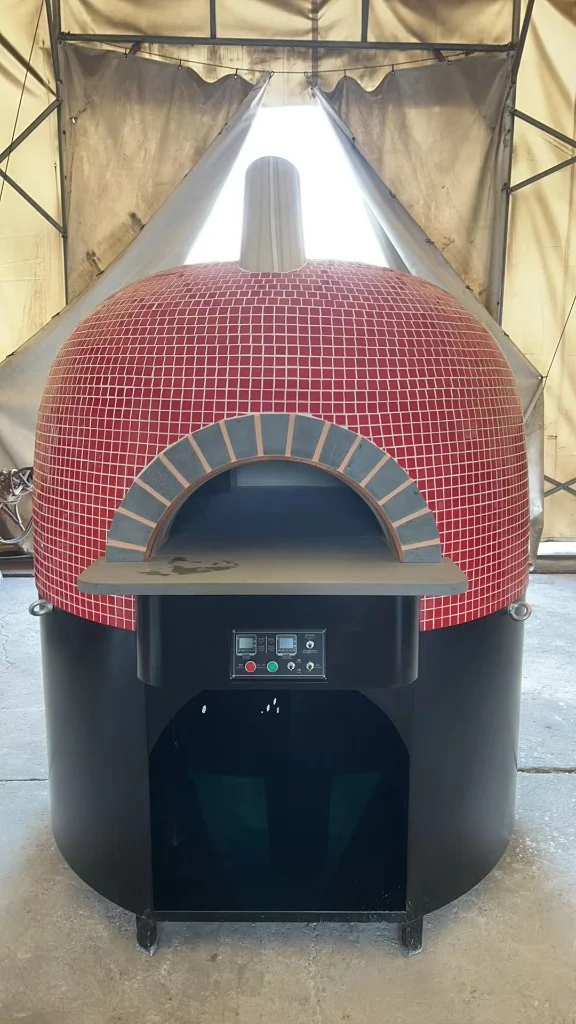 Commercial red mosaic dome pizza oven with black base and digital controls — indoor staging