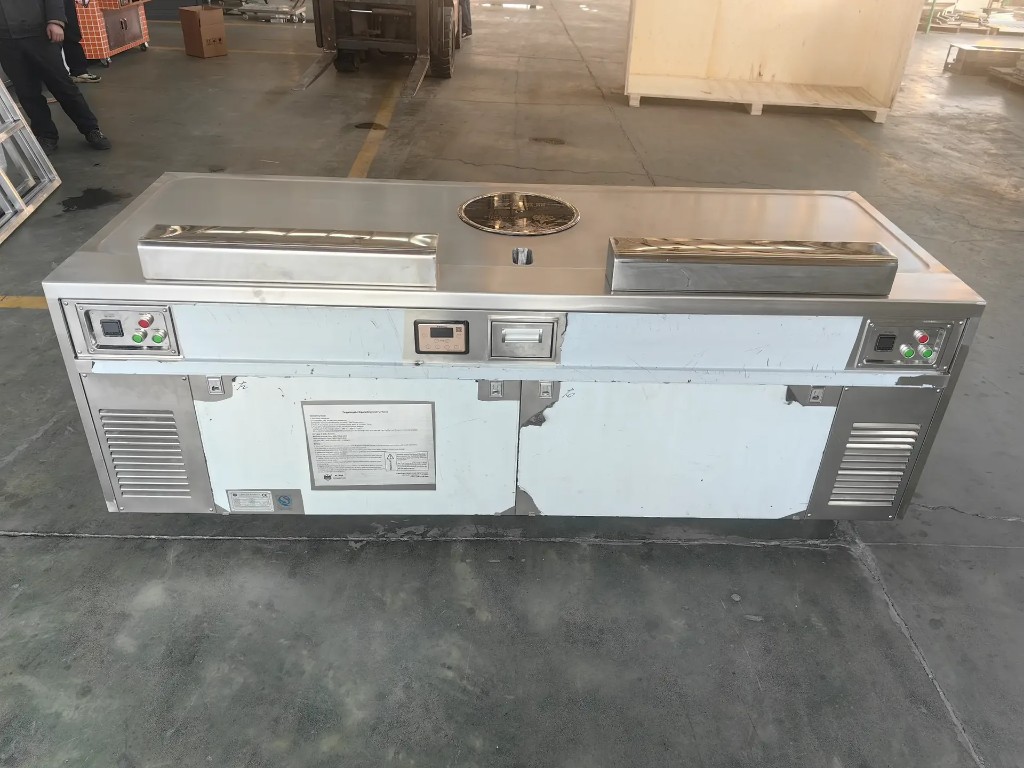 Long stainless teppanyaki workstation with front controls and lower ventilation grilles