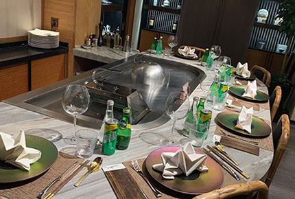 Curved marble teppanyaki table with chef dome cover and drinks