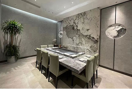 Private dining room with marble feature wall and active teppanyaki grill