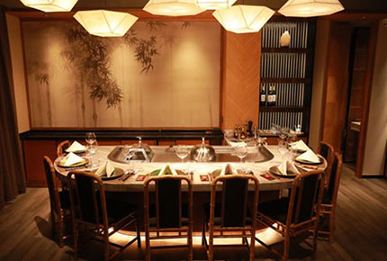 Private teppanyaki dining room with oval marble chef table